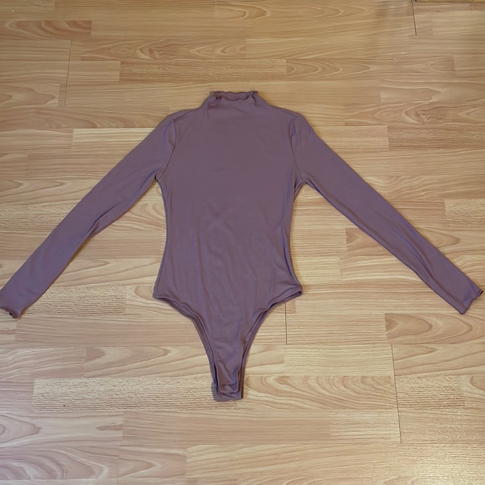 Never worn: long sleeve bodysuit